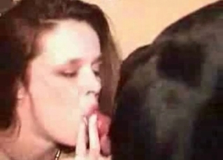 She’s closing her eyes to suck dog cock