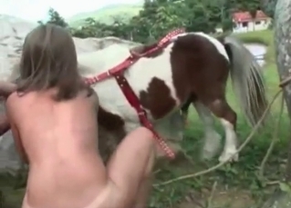 Tanned chick massaging them giant pony balls