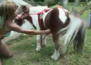 Tanned chick massaging them giant pony balls