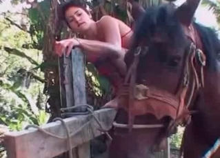 Totally nude chick and a horse